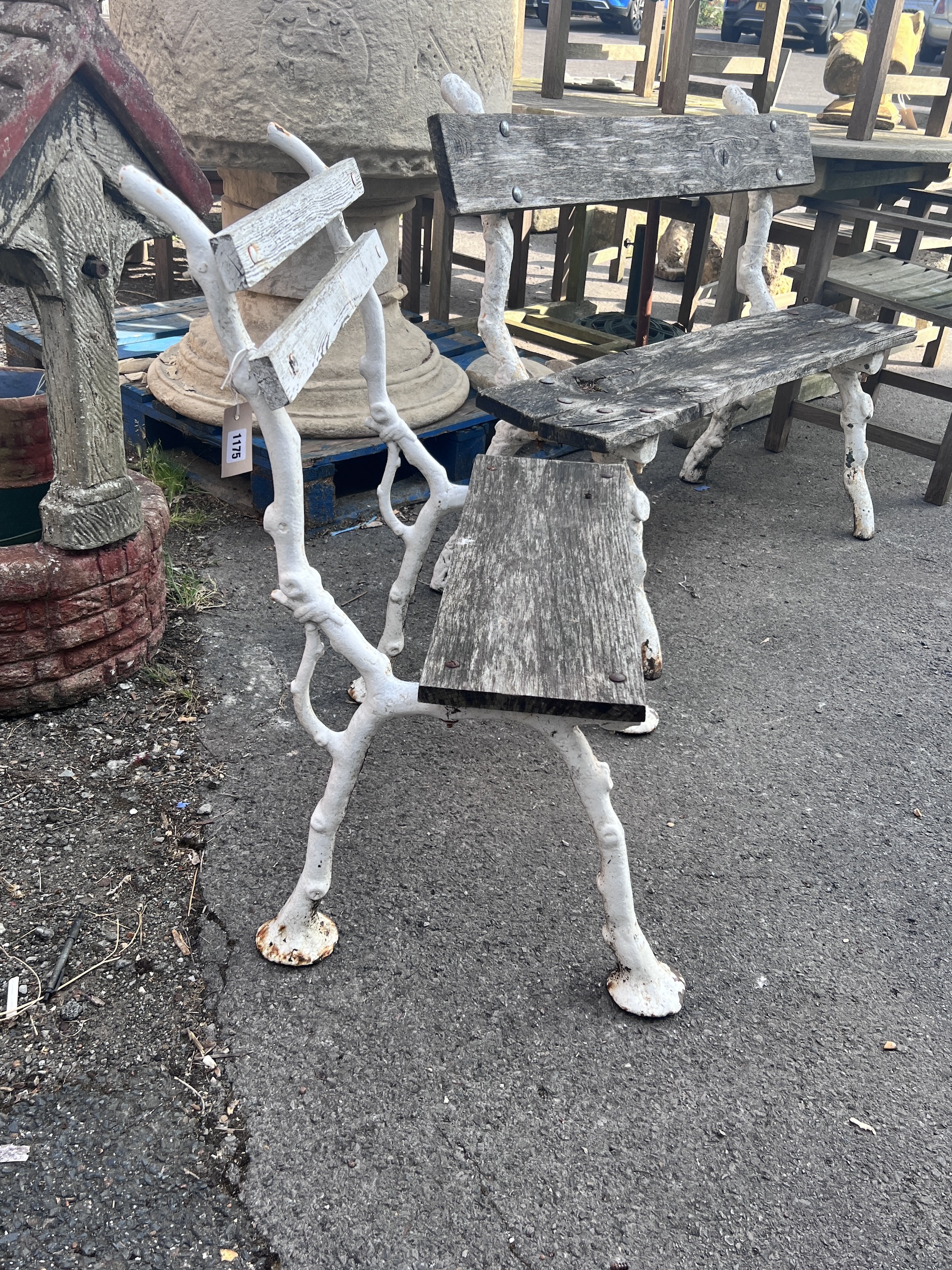 A Victorian Coalbrookdale style 'rustic' cast iron garden bench, larger width 119cm, height 87cm and a chair